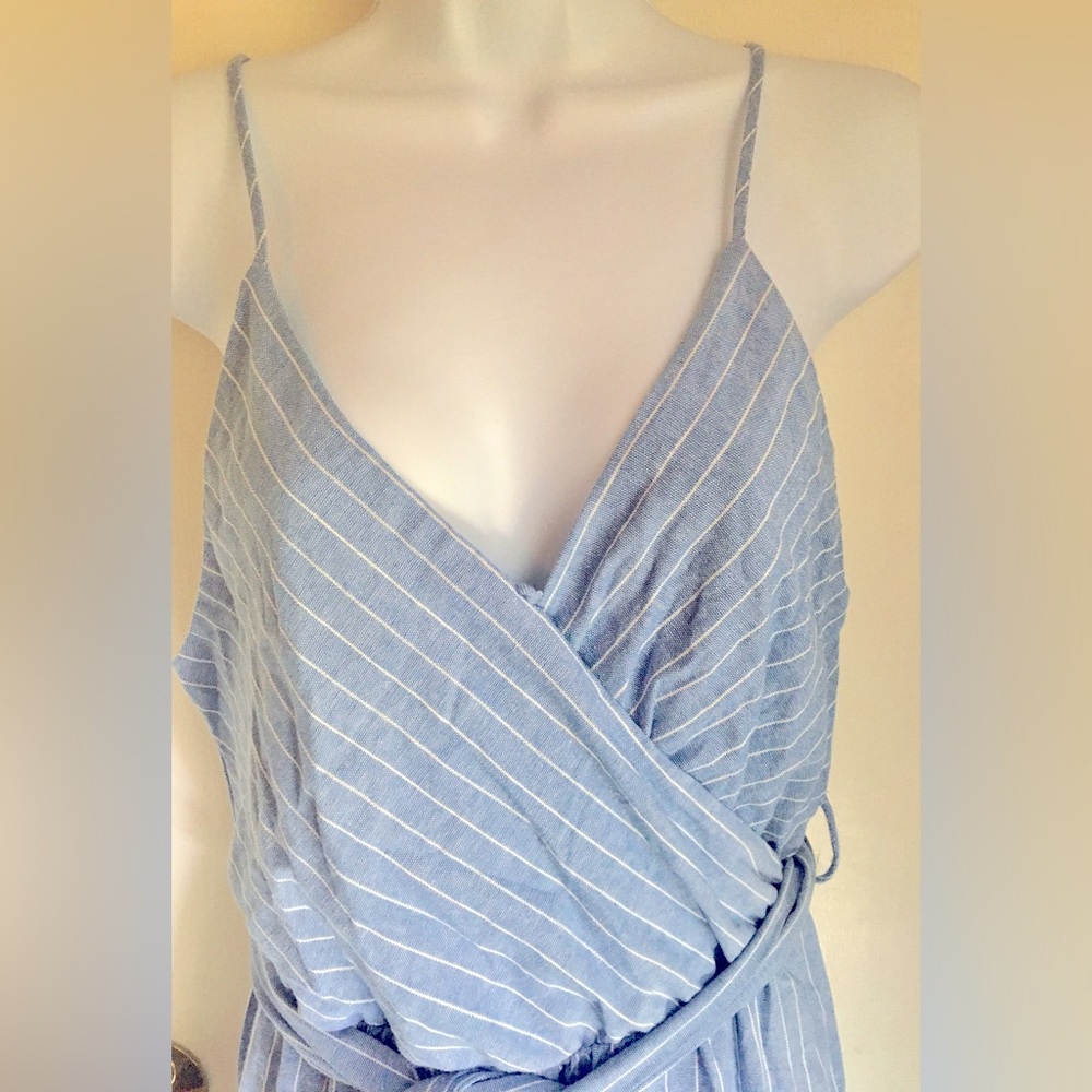 Sienna Sky Jumpsuit M. Never worn. Adjustable straps. Tie waist.